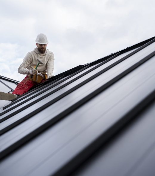 full-shot-man-working-roof-with-hammer