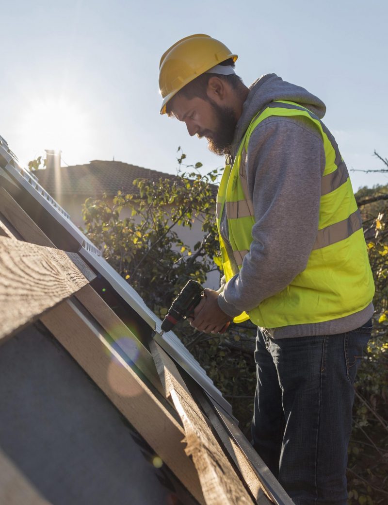 man-working-roof-with-drill